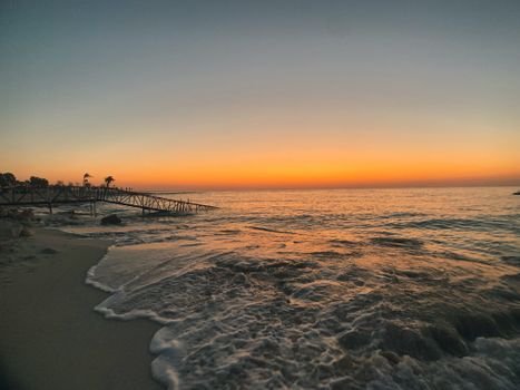 Captivating sunset over the waves at El Dabaa Beach, Egypt.