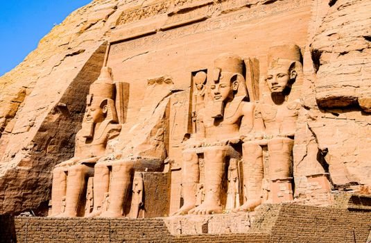 Explore the intricately carved statues of Ramses II at the Abu Simbel temple complex.