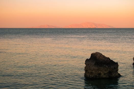 Serene beach scene at sunset in Sharm El-Sheikh, Egypt.