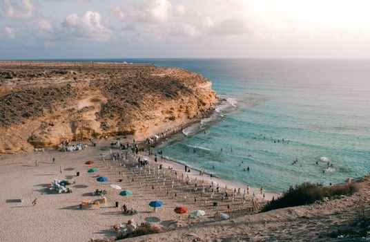 Explore the stunning coastline of Marsa Matruh with its golden cliffs and turquoise waters.