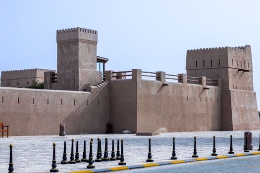 A traditional fort showcasing Arabian architectural style in the UAE under a clear blue sky.