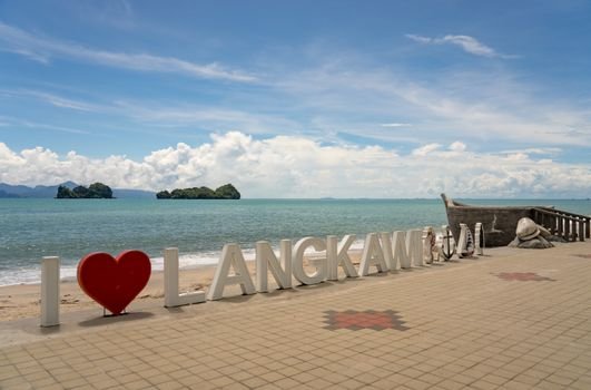 Sunny day at Langkawi beach, featuring iconic I Love Langkawi sign and stunning seascape.