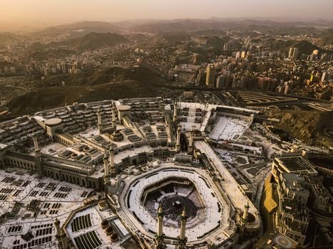 Stunning aerial shot of Masjid al-Haram in Mecca during dusk, highlighting the grandeur and serene atmosphere.