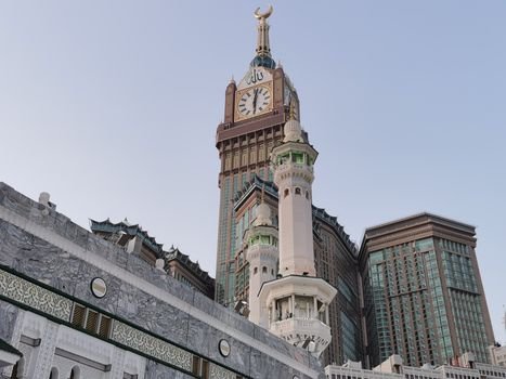 View of the iconic Abraj Al Bait and Mecca Clock Tower with surrounding architecture.